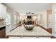 View from the kitchen island looking into the open living and dining room area at 245 Tapestry Dr, Mcdonough, GA 30252