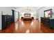 Bright and spacious main bedroom with wood floors, a ceiling fan and large windows at 245 Tapestry Dr, Mcdonough, GA 30252