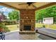 Outdoor fireplace, shed, and seating area offer a relaxing and inviting outdoor space at 245 Tapestry Dr, Mcdonough, GA 30252