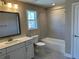 Bright bathroom with a vanity, mirror, tub-shower, and neutral decor for a clean and functional space at 2503 Wollerton St # 2503, Cumming, GA 30040