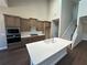 Spacious kitchen with a large island, custom cabinets, and built-in microwave and oven at 2503 Wollerton St # 2503, Cumming, GA 30040