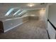 Spacious loft area filled with natural light and neutral carpeting, great for relaxing at 2503 Wollerton St # 2503, Cumming, GA 30040