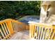 Wooden stairs leading from the new back deck, with lush trees and a glimpse of the home's exterior at 2751 Colonial Dr, College Park, GA 30337