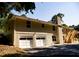 Spacious backyard with a patio, stairs, and garage, offering ample outdoor living space at 2751 Colonial Dr, College Park, GA 30337