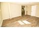 Bright basement featuring wood-look floors and ample sunlight at 2751 Colonial Dr, College Park, GA 30337