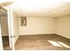 Spacious basement area with wood-look flooring and neutral walls at 2751 Colonial Dr, College Park, GA 30337