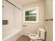 Modern bathroom featuring a subway tile shower/bathtub, new fixtures, and updated toilet at 2751 Colonial Dr, College Park, GA 30337