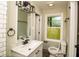 Updated bathroom with tiled walls, modern fixtures, and a window with a backyard view at 2751 Colonial Dr, College Park, GA 30337