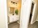 Modern bathroom featuring a floating vanity with elegant fixtures and contemporary lighting at 2751 Colonial Dr, College Park, GA 30337