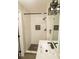 Modern bathroom featuring a subway tile shower, rainfall shower head and sleek black fixtures at 2751 Colonial Dr, College Park, GA 30337