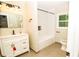 Bathroom with granite counters, vanity and new fixtures and subway tile bathtub at 2751 Colonial Dr, College Park, GA 30337