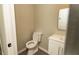 Cozy bathroom with modern toilet and single vanity sink at 2751 Colonial Dr, College Park, GA 30337