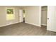 Bright bedroom with wood-look flooring and closet and doorway at 2751 Colonial Dr, College Park, GA 30337