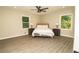 Bedroom featuring wood-look flooring and large windows at 2751 Colonial Dr, College Park, GA 30337