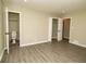 Bedroom with new wood flooring, closet and bathroom doorway at 2751 Colonial Dr, College Park, GA 30337