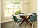 Dining area with modern light fixture, large window, and stylish seating at 2751 Colonial Dr, College Park, GA 30337