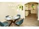Dining area showcasing modern chandelier and view into a pristine kitchen at 2751 Colonial Dr, College Park, GA 30337
