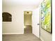 Entryway featuring modern flooring, neutral paint and entry to a utility room with lots of natural light at 2751 Colonial Dr, College Park, GA 30337