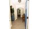 Welcoming entryway featuring arched doorways, neutral paint, and a classic light fixture at 2751 Colonial Dr, College Park, GA 30337