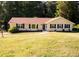 Charming single-story home featuring a well-manicured lawn and inviting exterior at 2751 Colonial Dr, College Park, GA 30337