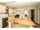 Modern kitchen with updated cabinetry, granite counters, subway tile backsplash, and stainless appliances at 2751 Colonial Dr, College Park, GA 30337