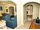 Inviting living room with arched entryways, modern furniture, and neutral color palette at 2751 Colonial Dr, College Park, GA 30337