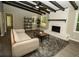 Inviting living room showcasing a decorative fireplace, exposed beams, and view into an adjacent room at 2751 Colonial Dr, College Park, GA 30337