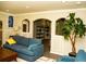 Open living space features sleek furniture, recessed lighting, and arched entryways to other rooms at 2751 Colonial Dr, College Park, GA 30337
