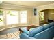 Bright living room with a bay window and an arched doorway to the dining area at 2751 Colonial Dr, College Park, GA 30337