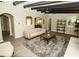 Comfortable living room with gray color scheme, fireplace, ceiling fan, arched passageways, and stylish décor at 2751 Colonial Dr, College Park, GA 30337