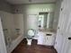 Standard bathroom featuring a shower-tub combo and vanity with a mirror at 4464 Cary Dr, Snellville, GA 30039