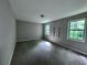 Spacious bedroom with neutral paint, carpeted floors, large windows, and closet at 4464 Cary Dr, Snellville, GA 30039