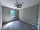 Bedroom featuring a window, carpet flooring, and a ceiling fan at 4464 Cary Dr, Snellville, GA 30039