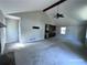 Open concept living room with vaulted ceilings, ceiling fan, hardwood floors, and kitchen access at 4464 Cary Dr, Snellville, GA 30039