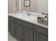 Bathroom vanity features gray cabinets, white countertop, brushed nickel hardware, and ample storage at 516 Altamaha Ct, Locust Grove, GA 30248