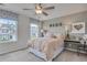 Bright bedroom with large windows, decorative window valances, and an inviting desk at 516 Altamaha Ct, Locust Grove, GA 30248