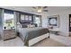 Spacious bedroom featuring a king size bed, side tables, and decor art pieces at 516 Altamaha Ct, Locust Grove, GA 30248