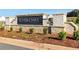 Stone entrance to River Oaks featuring a landscaped sign, plantings and inviting welcome to the community at 516 Altamaha Ct, Locust Grove, GA 30248