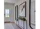 Bright foyer featuring modern decor, stylish console table, and eye-catching mirror accent, creating an inviting entry at 516 Altamaha Ct, Locust Grove, GA 30248