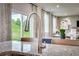 Close up of kitchen island with chrome faucet, granite countertops and windows showing backyard at 516 Altamaha Ct, Locust Grove, GA 30248