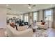 Spacious living area with a contemporary design, seamless flow to the kitchen, and ample natural light at 516 Altamaha Ct, Locust Grove, GA 30248