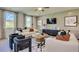 Bright living room with stylish furnishings, modern accents, and a cozy atmosphere create a welcoming space at 516 Altamaha Ct, Locust Grove, GA 30248