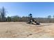 Full view of a community playground that includes swings, slides and other recreational equipment at 516 Altamaha Ct, Locust Grove, GA 30248