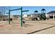 Swings in a community playground next to slides and structures designed for recreation at 516 Altamaha Ct, Locust Grove, GA 30248
