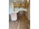 Kitchen featuring wood cabinets, quartz countertops, and laminate floors at 161 Silvercrest Dr, Acworth, GA 30101