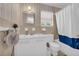 Classic bathroom with a tub, toilet and sink at 405 Emory St, Oxford, GA 30054