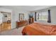 View of the bedroom showcasing a window, dresser, ceiling fan, and TV at 405 Emory St, Oxford, GA 30054