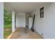 Attached carport featuring white brick walls, a convenient storage area, and natural light at 405 Emory St, Oxford, GA 30054