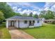Attractive single-story house with a covered carport and a well-manicured front yard at 405 Emory St, Oxford, GA 30054