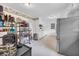 Functional kitchen with ample storage, featuring vintage wallpaper and stainless steel refrigerator at 405 Emory St, Oxford, GA 30054